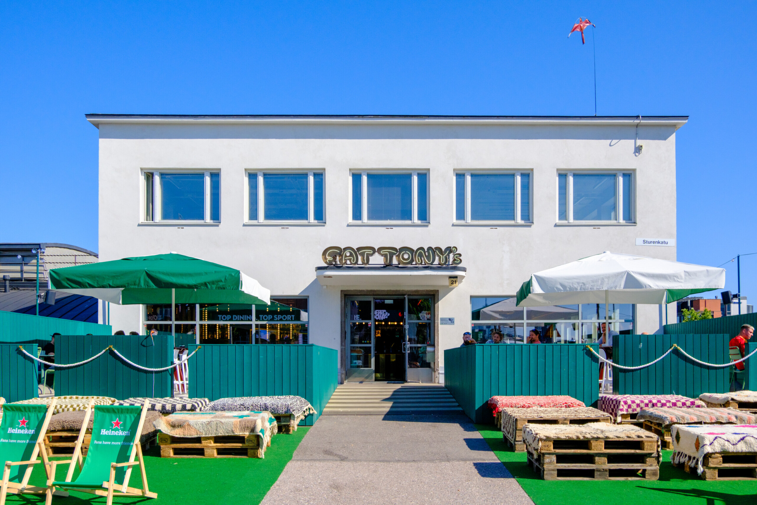 Fat Tony's Helsinki entrance and sunny outdoor terrace